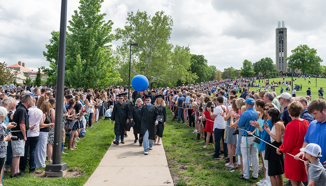 At long last, ’70 and ’72 grads walk down the Hill